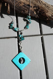 Blue Turquoise enhanced with Black Coral and Infinity symbol on Sterling Silver Chain