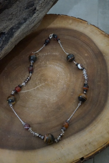 Sterling Silver Necklace enhanced with Fossilized Madagascar Wood, Onyx and Shell