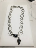 Handcrafted Silver Necklace adorned with an Arrow Head and Horn is approx. 12" in length.